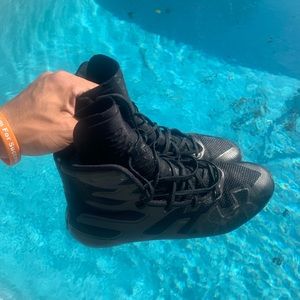 Black under Armor high top cleats